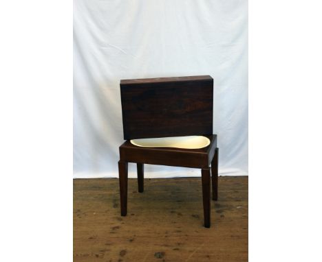 A mahogany commode with slip cover and porcelain liner, on square tapering legs.  21ins wide.  Est £10-20