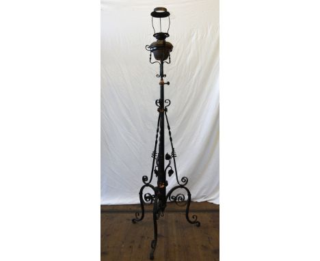 A wrought iron and copper floor standing lamp by Duplex, the stand with scroll and stylised leaf decoration.  Est £20-40