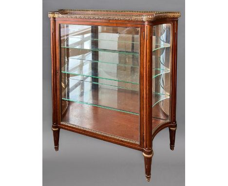 A FRENCH MAHOGANY AND ORMOLU MOUNTED VITRINE. 19th century in the Louis XV style, the glazed top with brass gallery above a b