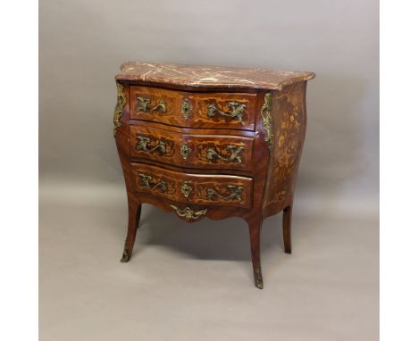 A LOUIS XV STYLE MARBLE TOPPED PETIT COMMODE. 19th century, of serpentine form, the marble top above three marquetry inlaid d