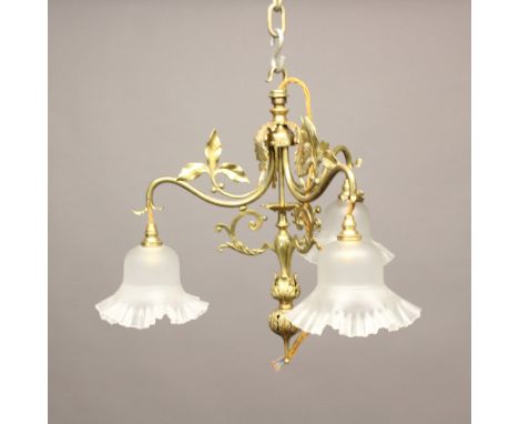 A BRASS THREE BRANCH CEILING LIGHT. of scrolling form with leaf decoration, height 43cm, width 40cm. * Tarnishing and rubbing