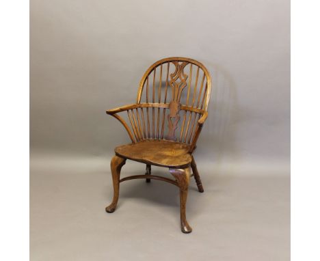 A 19TH CENTURY YEW WOOD WINDSOR ARMCHAIR. with pierced splat, saddle seat and crinoline stretcher, height 99cm, width 65cm. *