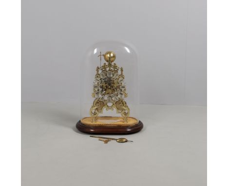 A BRASS SKELETON CLOCK. 20th century, the 6 3/4" silvered and pierced Roman numeral dial on a twin fusee movement striking to