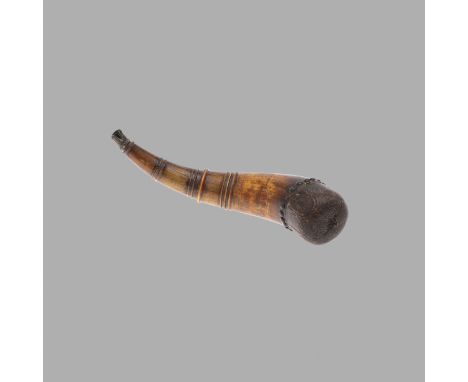 A SCRIMSHAW HORN. carved with horses and birds, signed Augustin LaFleche, ringed with metal studs and plugged with an oak ter