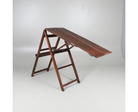AN OAK ARTIST'S TRAVELLING TABLE/EASEL. probably early 20th century, folding out into both a work table with recess for palet