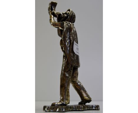 8¼" CONTINENTAL WHITE METAL FIGURINE MODELLED AS A MAN PLAYING A BUGLE     