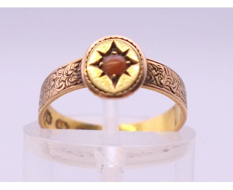 A Victorian 18 ct gold coral set ring. Ring size H/I. 1.9 grammes total weight. 