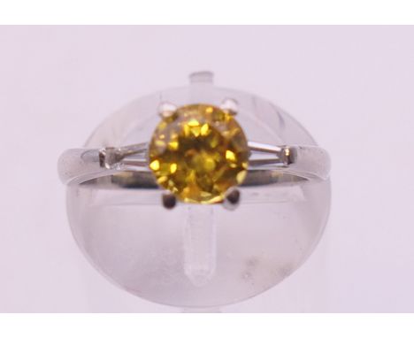 A platinum diamond and yellow sapphire ring. Ring size K/L.