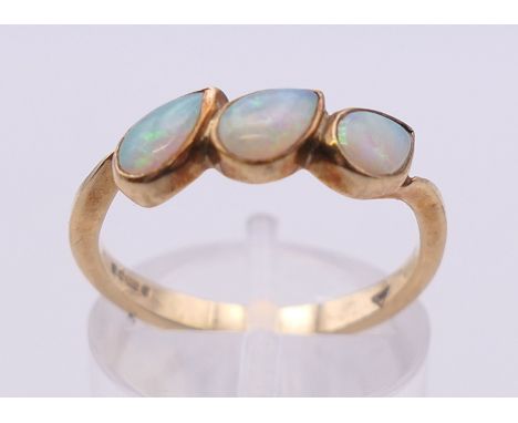 A 9 ct gold and opal ring. Ring size O.