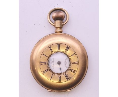 A 14 K gold stiffened half hunter pocket watch. 4 cm diameter. 