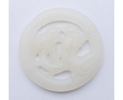 A white jade bird pendant. 5 cm diameter.