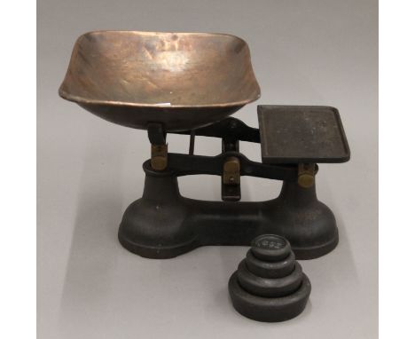 A vintage set of scales and weights. The pan 35 cm wide.