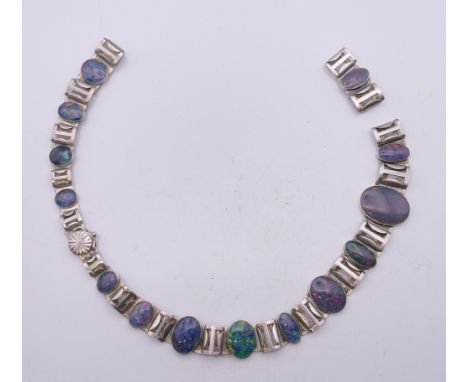 A silver and opal necklace. 39 cm long. 