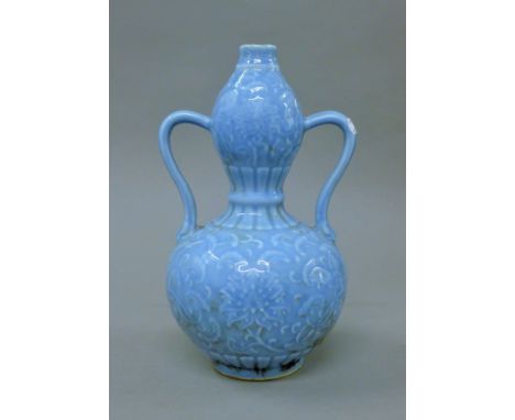 A Chinese blue double gourd vase.  30 cm high. 