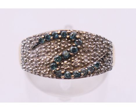 An 18 ct gold diamond set ring. Ring size P.