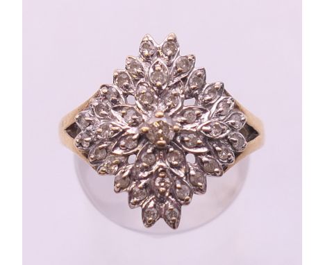 A 9 ct gold diamond cluster ring. Ring size O/P.