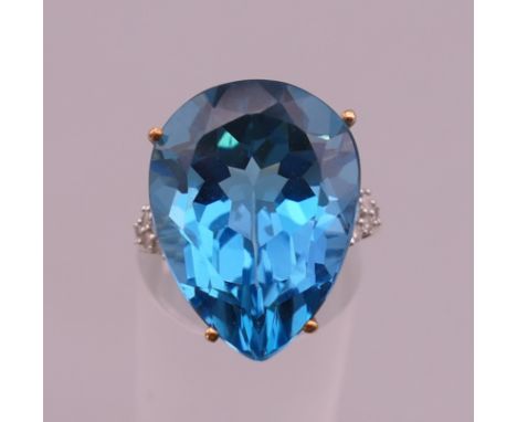 A 9 ct gold blue stone and diamond set ring.  Ring size N/O.  6.9 grammes total weight.