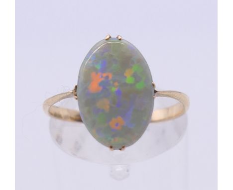 A 9 ct gold and opal ring. Ring size M/N.