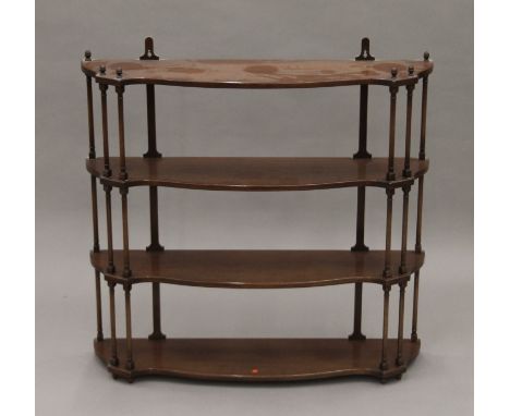 An early 20th century mahogany hanging shelf. 83 cm wide.