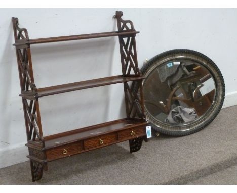 Chippendale style mahogany wall rack and an oval framed mirror with bevel edge glass