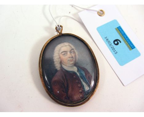 English School (late 18th century): Oval portrait miniature of a gentleman watercolour on ivory in red jacket grey curled wig
