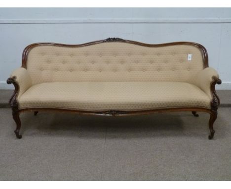 Victorian walnut framed serpentine three seat upholstered sofa on French cabriole legs, L216cm