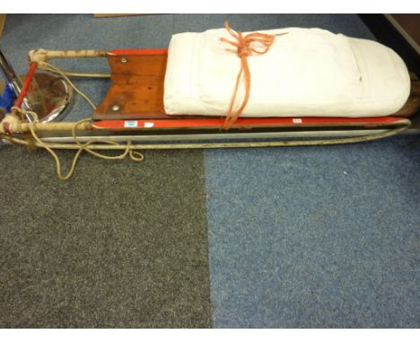 Large vintage wood sled, pair of  vintage ice skates, pair of oars and a hockey stick