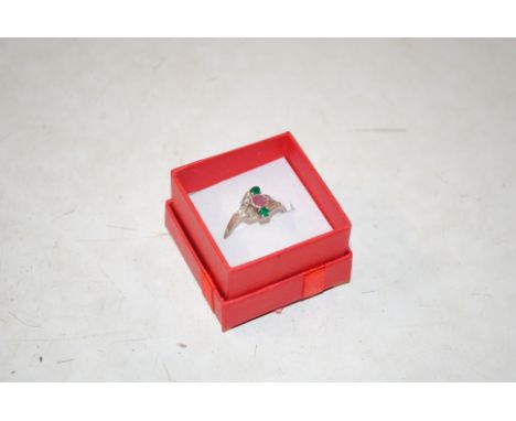 A vintage white metal ruby, diamond and emerald set ring, size O/P