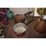 Three copper saucepans one with lid