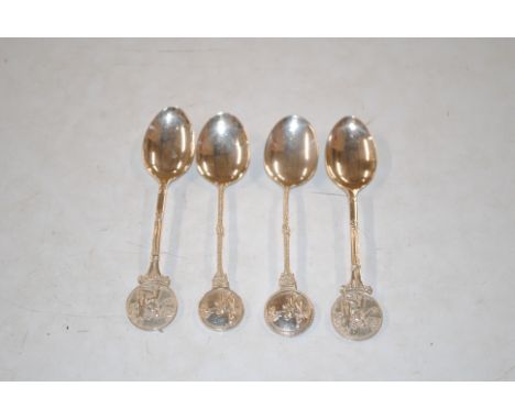 Four silver lawn bowls related spoons, approx. 59gm