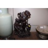 A Chinese carved hardwood figure group