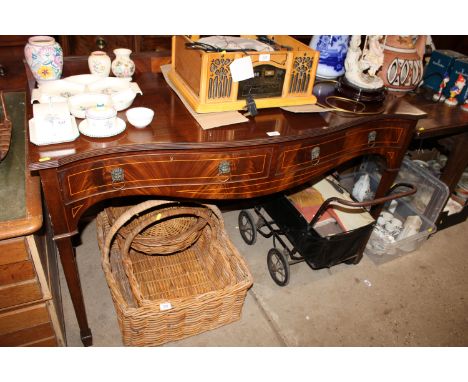 A reproduction mahogany serpentine fronted buffet fitted two drawers