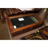 A glazed oak two layer table topped display case