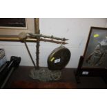 A brass gong and ink well