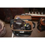 An Olympus OM-2 camera in fitted case with various