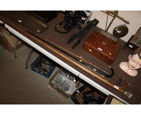 Four silver collared and capped walking sticks and a horn handled walking stick