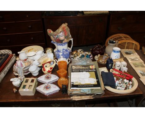 A collection of decorative china to include two shaped dishes with covers; a blue and white jug; various thimbles; a Haynes '