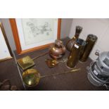 A pair of brass shell cases, two chestnut roasters