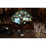 A Tiffany style figural decorated lamp