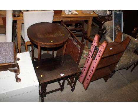 A graduated pair of oak occasional tables, an Edwardian inlaid circular table, a firescreen and a fireside chair