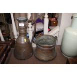 An antique copper cauldron and an eastern copper e