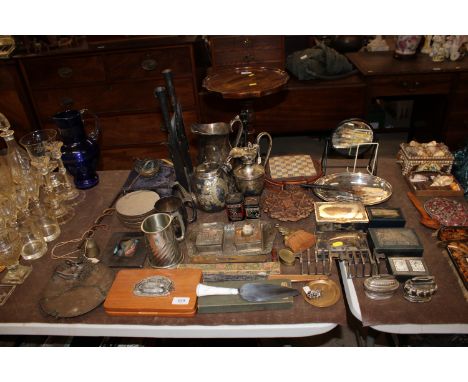 A collection of metalware including trinket boxes, cigarette boxes, lighters, toast rack, tea ware and a chess set etc