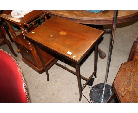 An Edwardian mahogany and satin wood crossband fold over card table