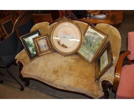 A Victorian carved mahogany framed and button backed upholstered settee
