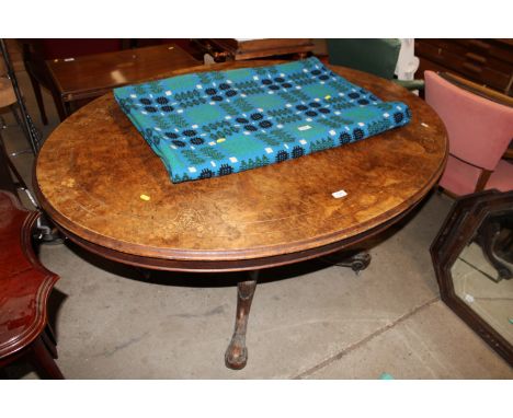 An inlaid walnut oval tilt topped loom table