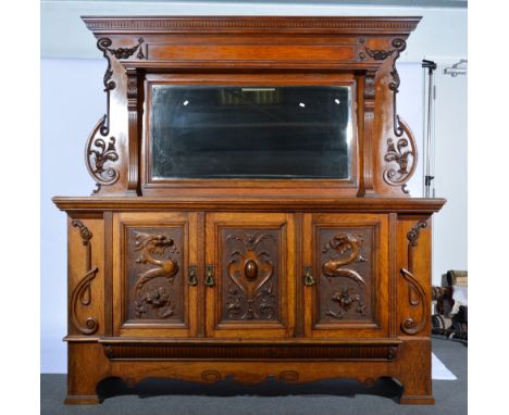 Victorian oak mirror-back sideboard, shelf over base with three carved panel doors, labelled Inglesant & Sons Ltd, Leicester,