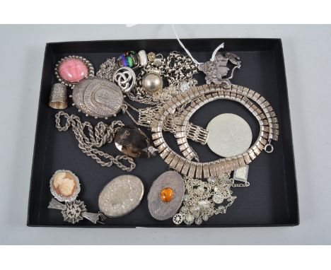 A collection of vintage and modern silver jewellery, three oval lockets, a fringe necklace, gate bracelet, brooches, a rhodon
