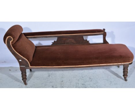 Victorian walnut-framed chaise longue, scrolled end, railed back with a carved panel, turned and ringed legs, length approxim