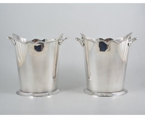 A pair of silver-plated oval wine coolers, undulating bead edge top with ring handles on single oval foot,18cm x 13cm, 20cm h