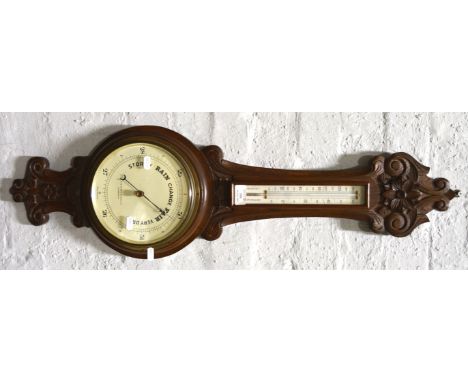 Barometer and thermometer, carved oak case, signed T.B. Heath & Son, Leicester, 88cm.